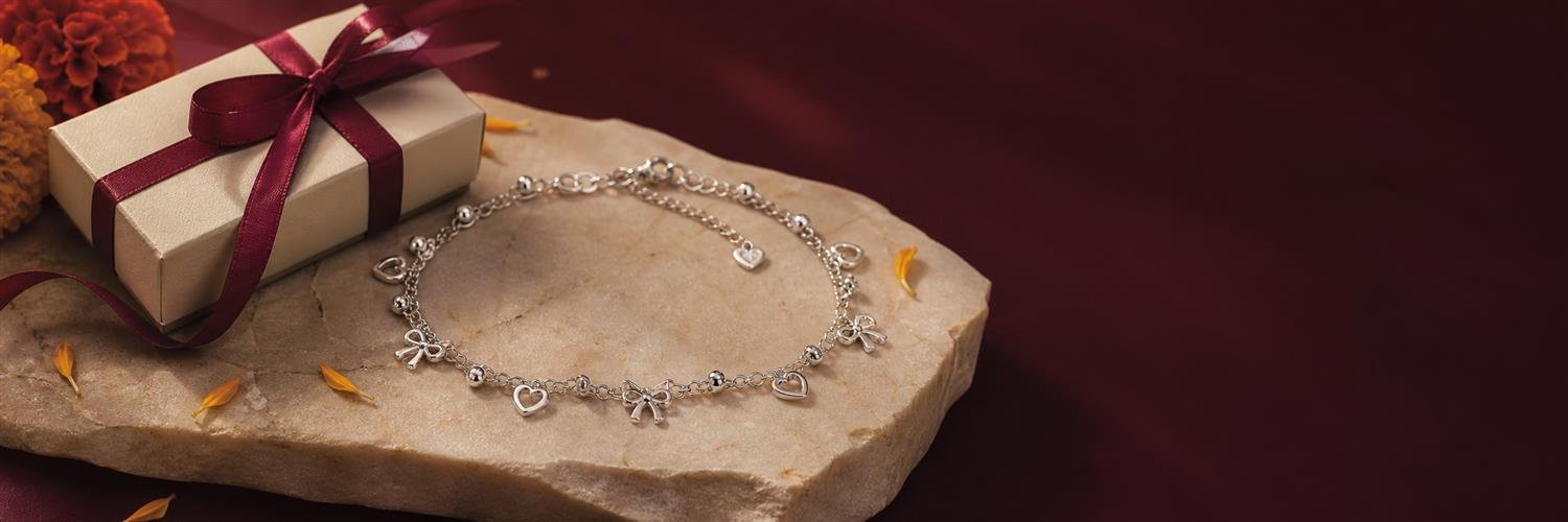 Silver charm jewellery presented as a thoughtful gift