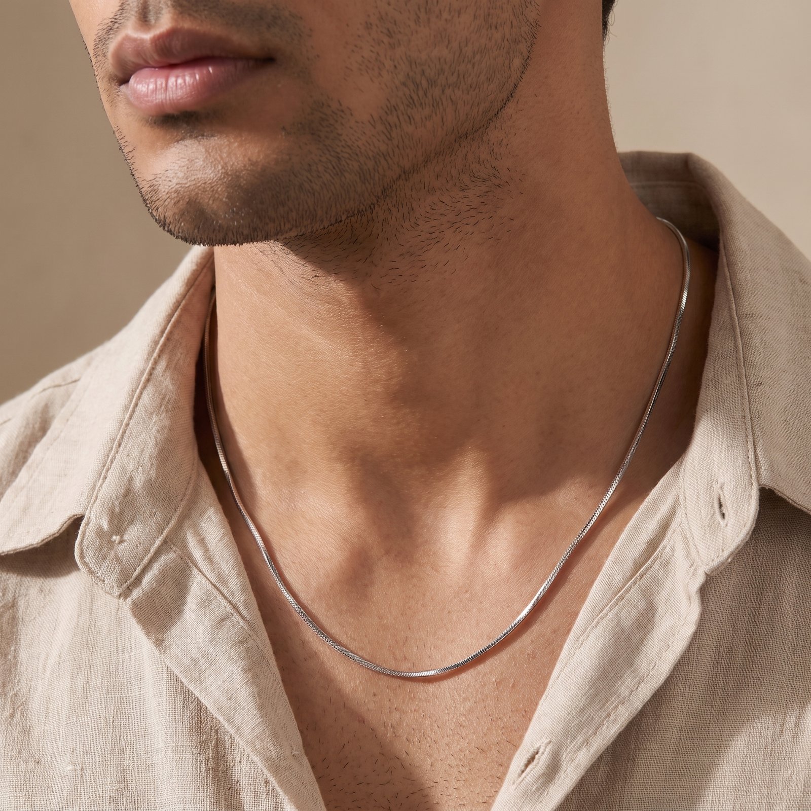 Man wearing a fine silver chain